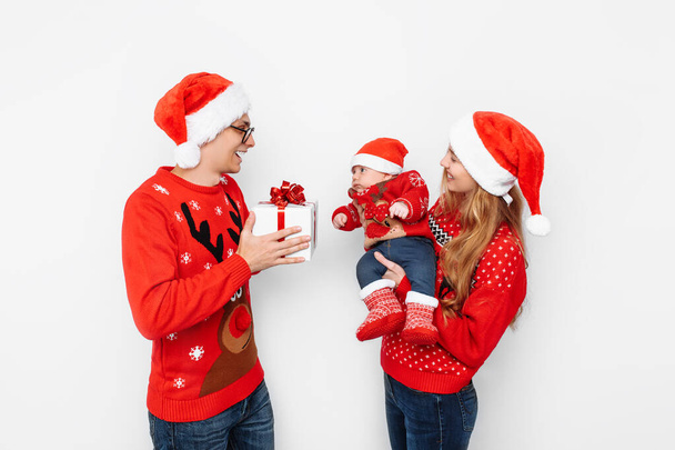 Happy family, dad mom and little baby, celebrate Christmas and g - Photo, Image