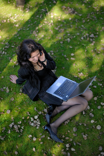 Young lady with notebook in park - Photo, Image
