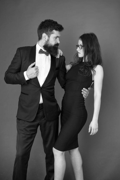 Award ceremony concept. Bearded gentleman wear tuxedo girl elegant dress. Formal dress code. Visiting event or ceremony. Couple ready for award ceremony. Corporate party. Gorgeous couple in love - Фото, изображение