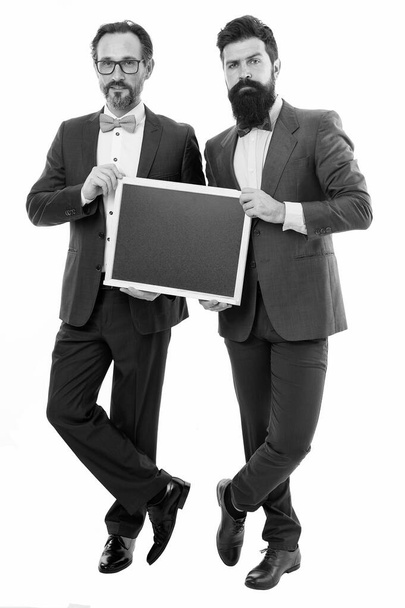 businessmen in suit, copy space. partners celebrate start up business isolated on white. announcement. party invitation. bearded men hold advertisement blackboard. welcome on board. advertisement. - Fotó, kép