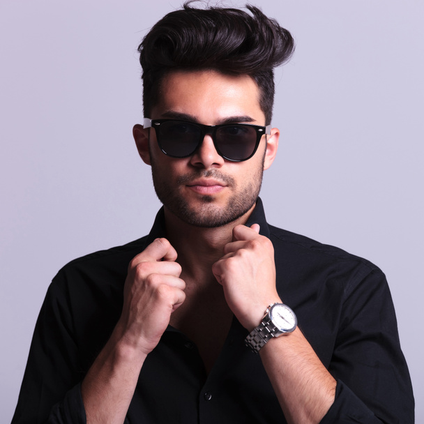 young fashion man with hands on collar - Photo, Image