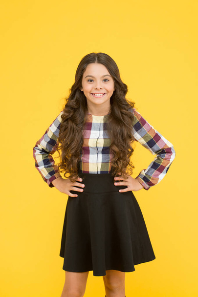 Fashion never goes out of school. Little schoolchild in formal fashion yellow background. Small vogue model with fashion look. Stay in fashion be happy. Back to school - Photo, Image