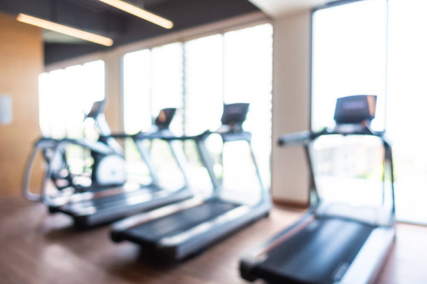 Abstract blur and defocused fitness equipment in gym interior - Photo, Image