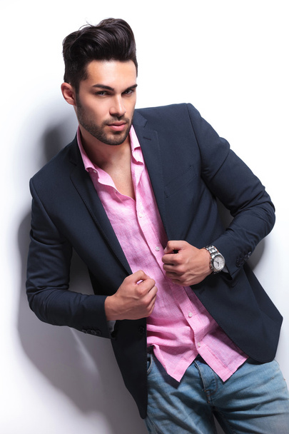 young fashion man holding hands on suit jacket - Photo, Image