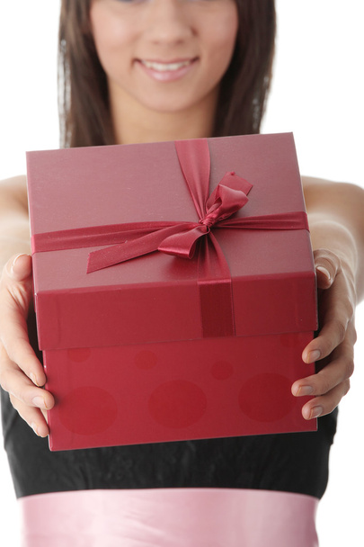 Young elegant woman in black dress with gift - Foto, Imagen