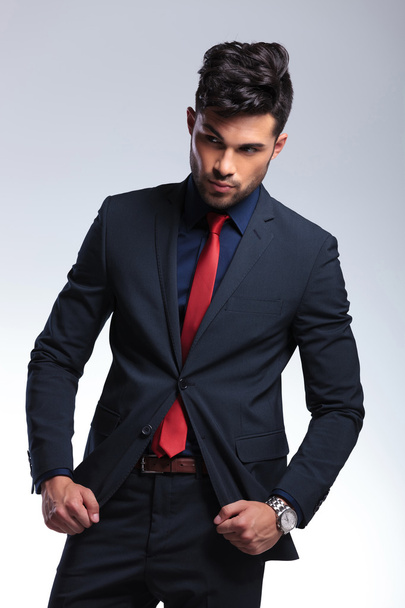business man fixes his suit jacket - Photo, Image