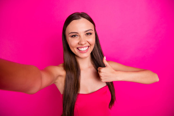 Self-portrait of her she nice-looking attractive lovely gorgeous content cheerful cheery long-haired girl showing thumbup ad advert isolated on bright vivid shine vibrant pink fuchsia color background - Photo, Image