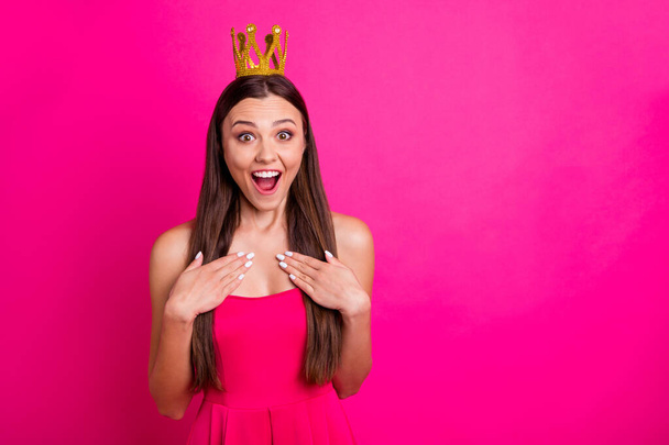 Close-up portrait of her she nice attractive glad cheerful cheery long-haired girl wearing crown expressing delight great news isolated on bright vivid shine vibrant pink fuchsia color background - Photo, Image
