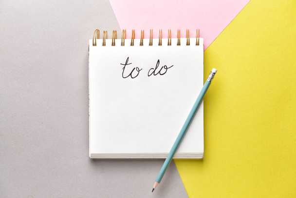 Empty to do list and pencil on color background - Photo, Image
