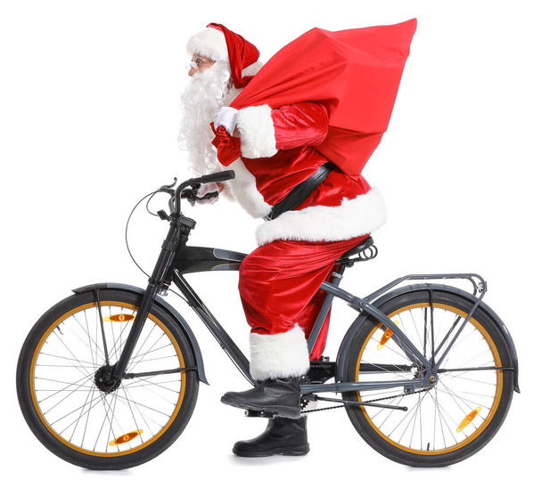 Санта-Клаус с сумкой и велосипедом на белом фоне
 - Фото, изображение