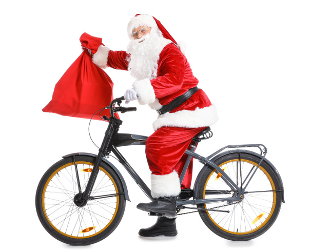 Санта-Клаус с сумкой и велосипедом на белом фоне
 - Фото, изображение