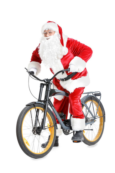 Beyaz arka planda bisikleti olan Noel Baba - Fotoğraf, Görsel