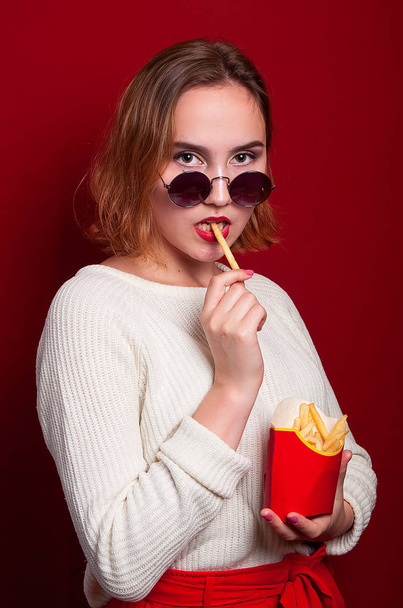 beautiful girl with French fries and drink - Photo, image