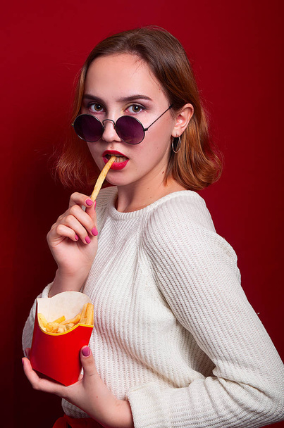 beautiful girl with French fries and drink - Photo, image