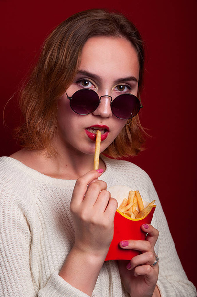 beautiful girl with French fries and drink - Фото, зображення
