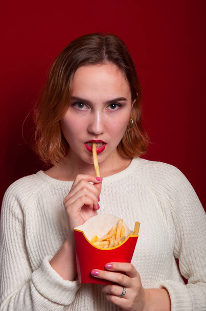 beautiful girl with French fries and drink - Фото, зображення