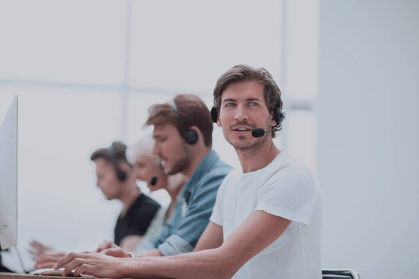 group of people in the headset works on personal computers. - 写真・画像