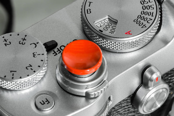 silver color camera shutter button and dial closeup view - Photo, Image