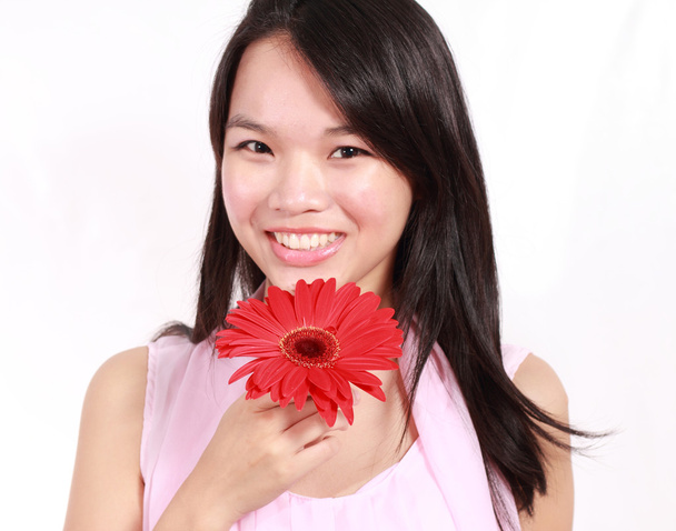 Lady with gerbera flower - Photo, Image