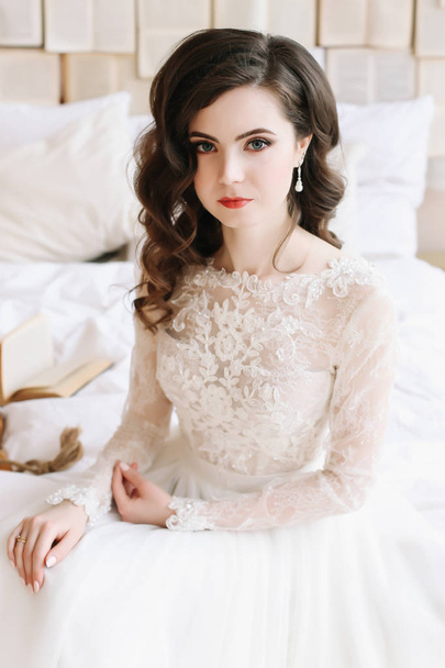 Bride in lingerie. Morning wedding gatherings. tenderness concept. Elegant classic wedding dress.  - Fotografie, Obrázek
