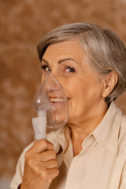 Portrait of elderly woman with flu inhalation - Fotografie, Obrázek