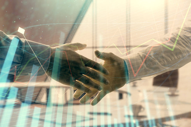 Multi exposure of financial graph on office background with two businessmen handshake. Concept of success in business - Foto, afbeelding
