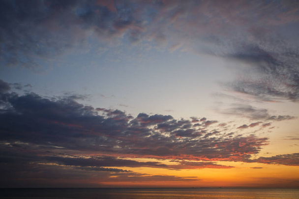 Beautiful sunrise near the sea in the early summer morning - Fotó, kép