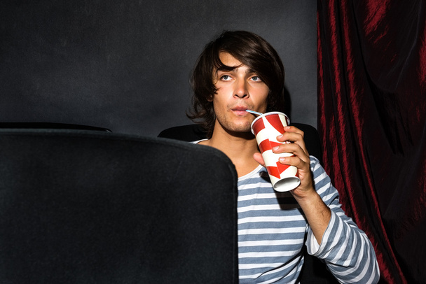 Man Drinking Soda In Cinema Theatre - 写真・画像