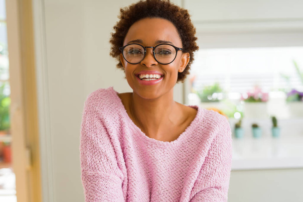 Beautiful young african woman with afro hair wearing glasses - Photo, Image