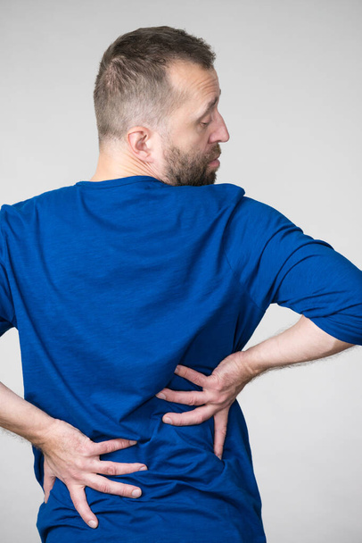 Man having back loins pain ache - Фото, изображение