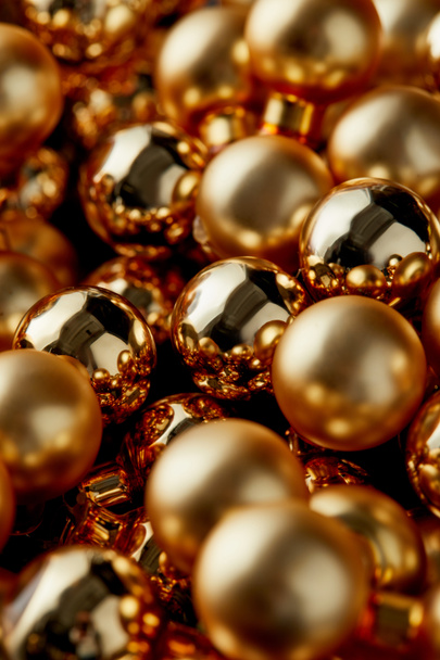 close up view of shiny golden Christmas baubles - Φωτογραφία, εικόνα
