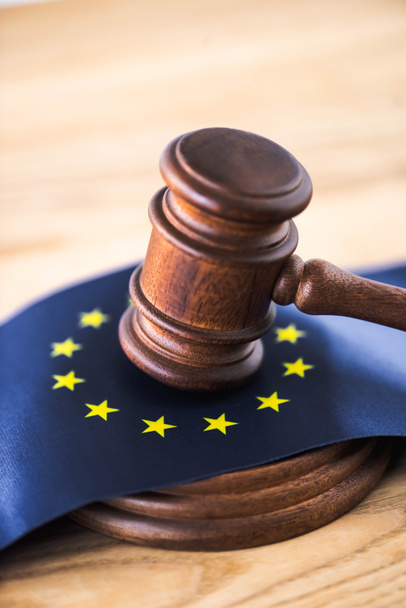 gavel of judge with european union flag on wooden table  - Фото, зображення