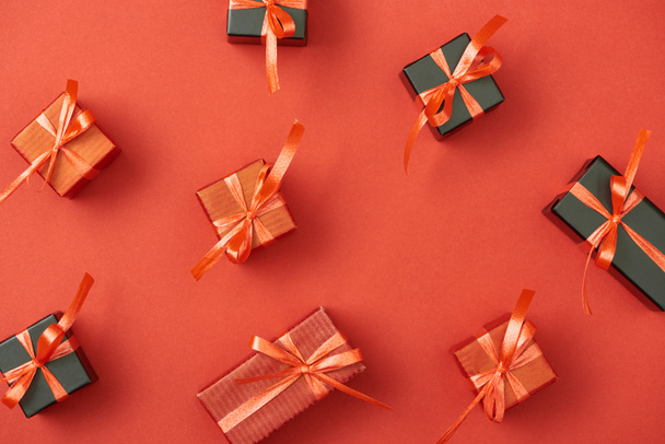 top view of small gift boxes on red background - Photo, Image