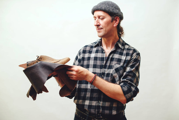 Artisan modeling new shoe at his workshop. Small business concep - Photo, Image