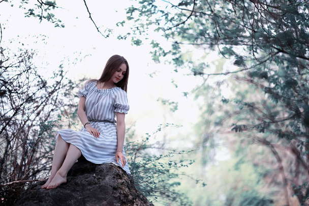 A girl in a spring green park - Zdjęcie, obraz