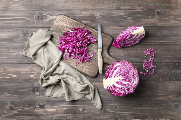 Fresh cabbage with cutting board and knife on wooden table - Photo, Image