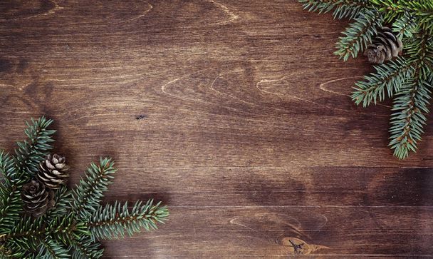 New Year's background. Spruce branches on a wooden table. Orname - Foto, imagen
