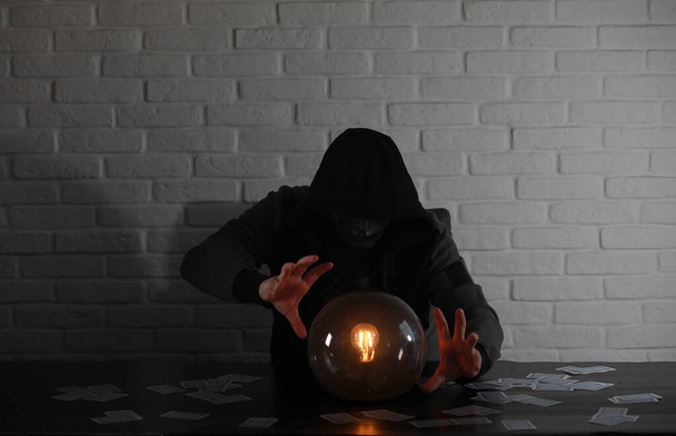 A man with a fortune teller ball - Photo, Image
