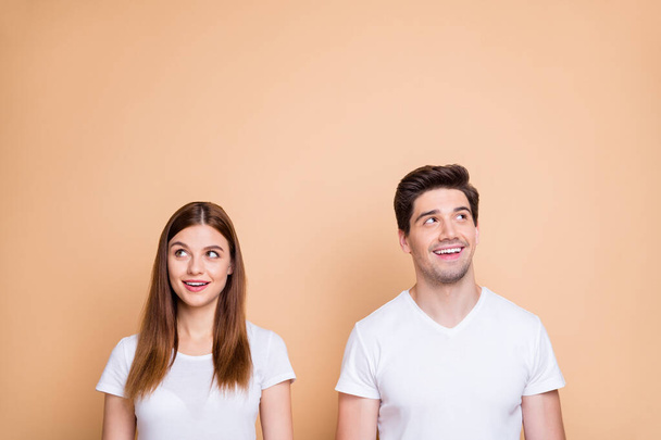 Portrait of his he her she nice attractive lovely curious cheerful cheery smart clever intelligent couple wearing white t-shirt creating solution learning isolated over beige pastel color background - Photo, Image
