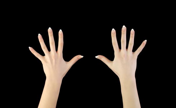zwei Frauenhände in der Dunkelheit - Foto, Bild