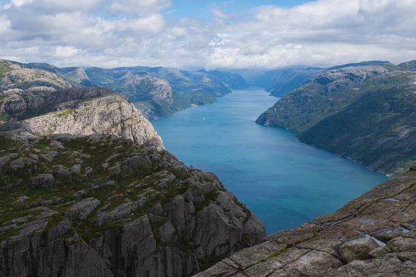 Preikestolen massive cliff Norway, Lysefjorden summer morning view . Beautiful natural vacation hiking walking travel to nature destinations concept. July 2019 - Photo, Image