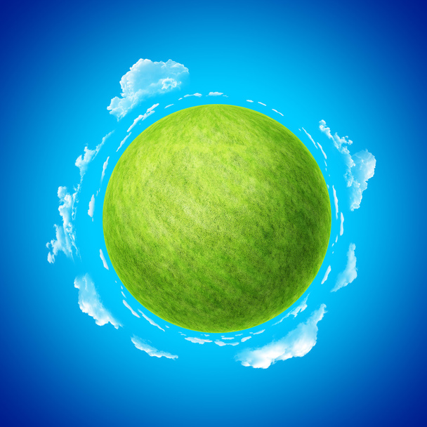 Зеленая планета с голубым небом и облаками шаблон концепции
. - Фото, изображение