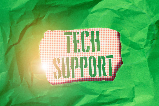 Text sign showing Tech Support. Conceptual photo Assisting individuals who are having technical problems Green crumpled ripped colored paper sheet centre torn colorful background. - Photo, Image