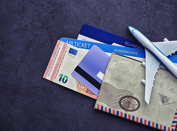 Air ticket and passport for flight plane. Travel concept. Ticket - Foto, afbeelding