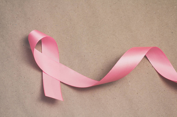 Pink ribbon. Symbol of breast cancer awareness. Health care conception. Preventive measures. October checking time.  - Fotografie, Obrázek