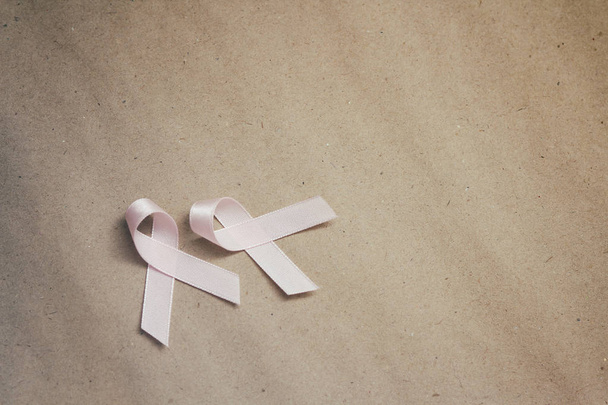 Pink ribbon. Symbol of breast cancer awareness. Health care conception. Preventive measures. October checking time.  - Zdjęcie, obraz