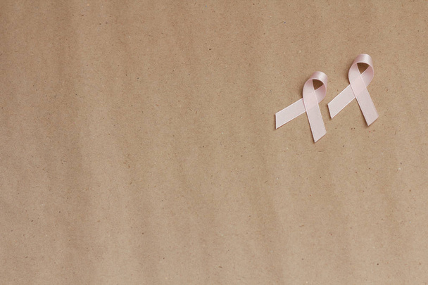 Pink ribbon. Symbol of breast cancer awareness. Health care conception. Preventive measures. October checking time.  - Valokuva, kuva