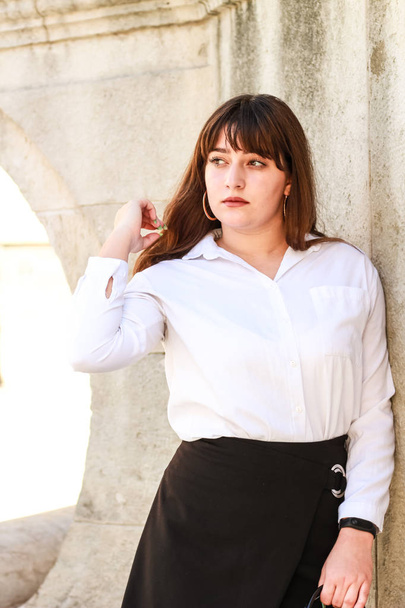 Business lady.Fashion woman. White shirt, black skirt. Backgroun - 写真・画像