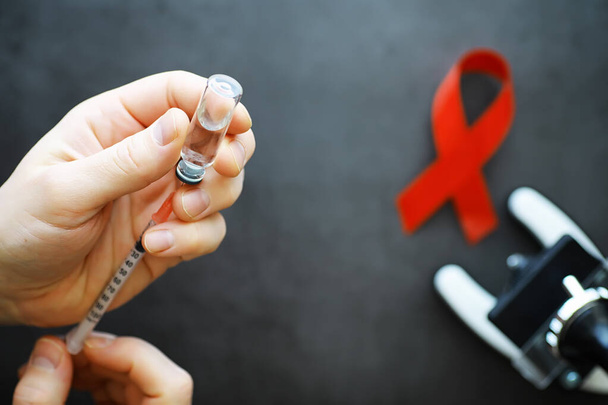 Symbol of human immunodeficiency virus disease. Red ribbon. A he - Valokuva, kuva