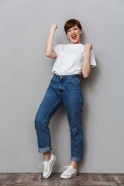Full length image of excited woman screaming and gesturing as wi - Photo, image
